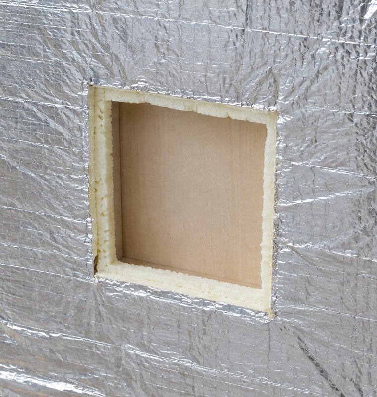 Opening cut in the foil and insulation on the inside of the spa panel